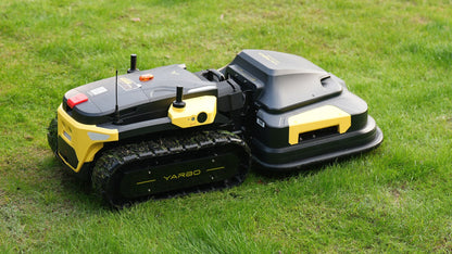 Yarbo Core and Lawn Mower module on grass, rubber tracks in close view