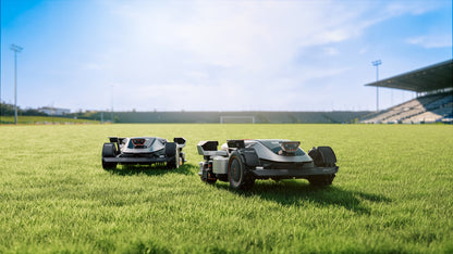 Two Sunseeker X9 Plus mowers on a sports field, showing the scale of area covered