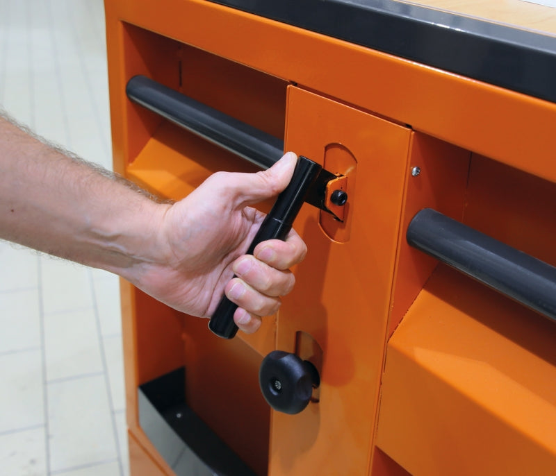Operating the C30M built-in hydraulic jack lever that lifts the front of the workbench