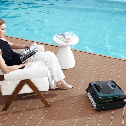Beatbot AquaSense 2 Pro resting on a pool deck beside a woman reading in a chair
