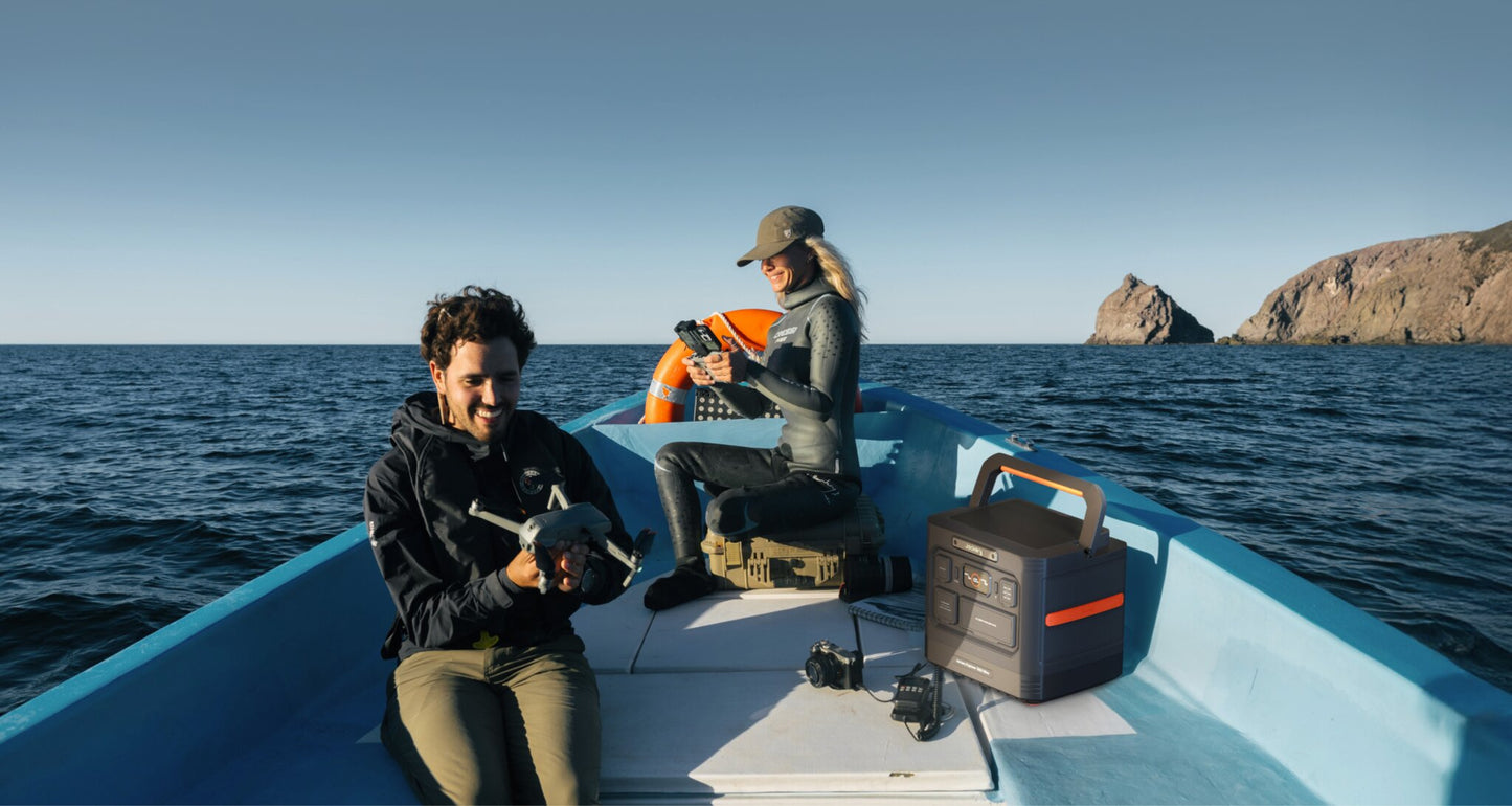 Jackery Explorer 1500 Ultra on a boat deck powering camera and drone gear for photographers