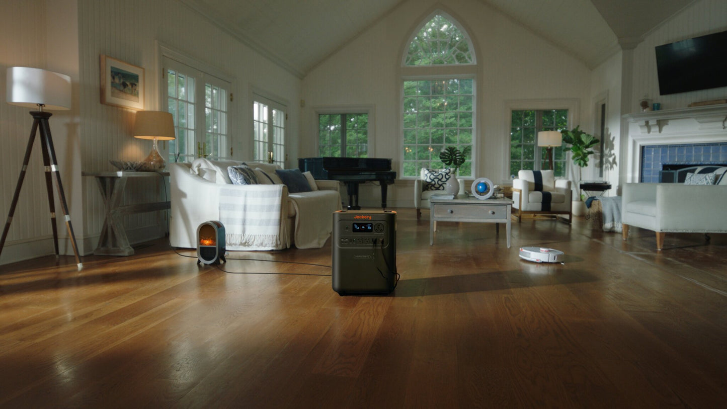 HomePower 3600 Plus in a bright living room powering an electric fireplace and robot vacuum