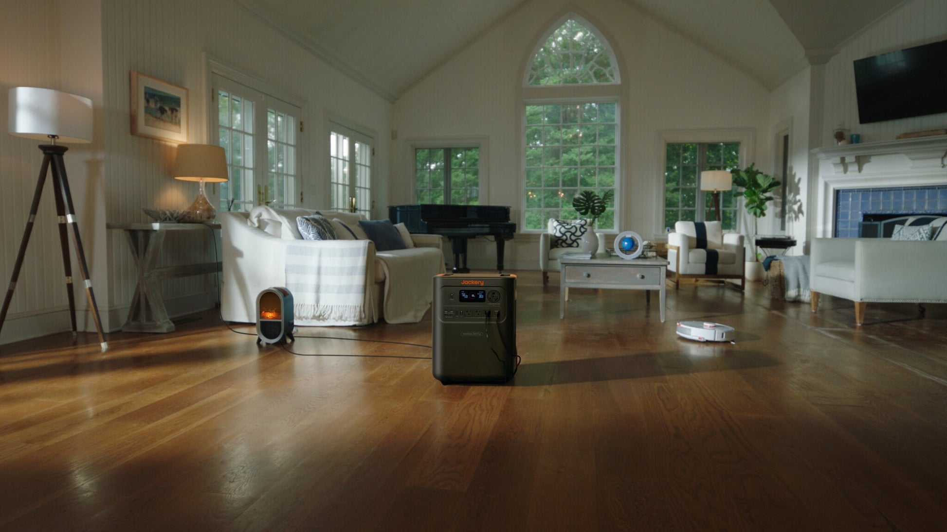 HomePower 3600 Plus in a bright living room powering an electric fireplace and robot vacuum