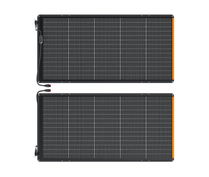 Two unfolded SolarSaga 500X solar panels laid flat side by side on white background