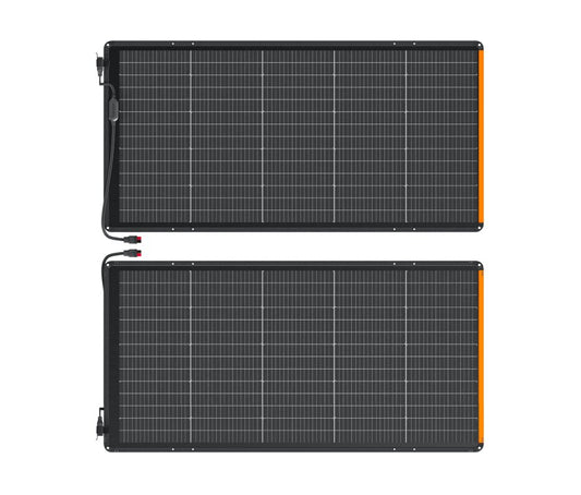 Two unfolded SolarSaga 500X solar panels laid flat side by side on white background